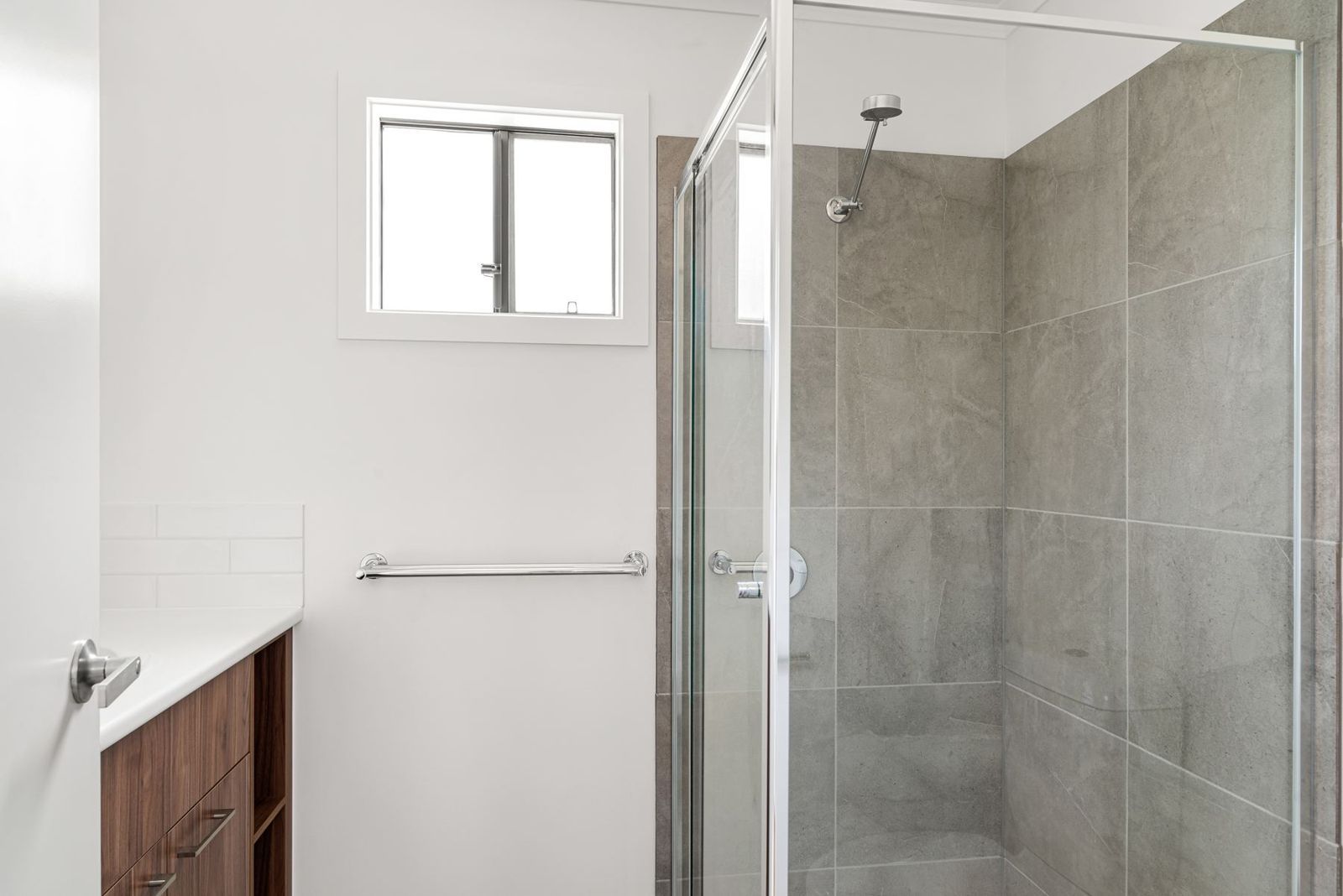 Bathroom with glass-screen shower and timber vanity