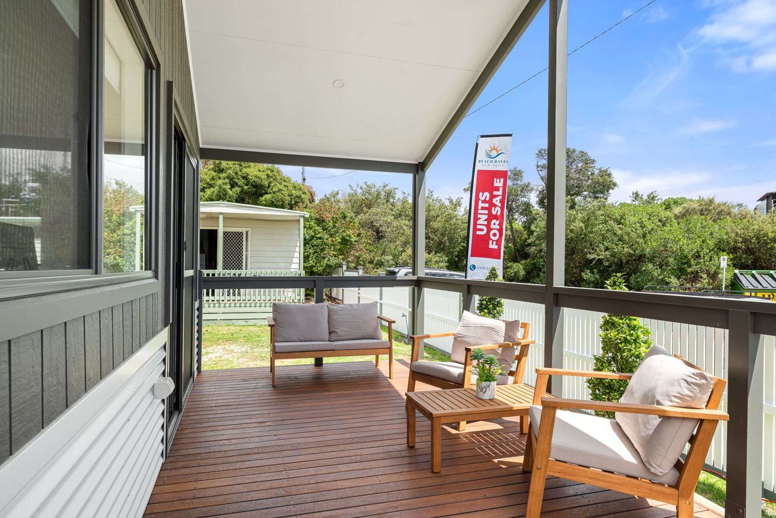 Covered timber balcony with outdoor lounge setting